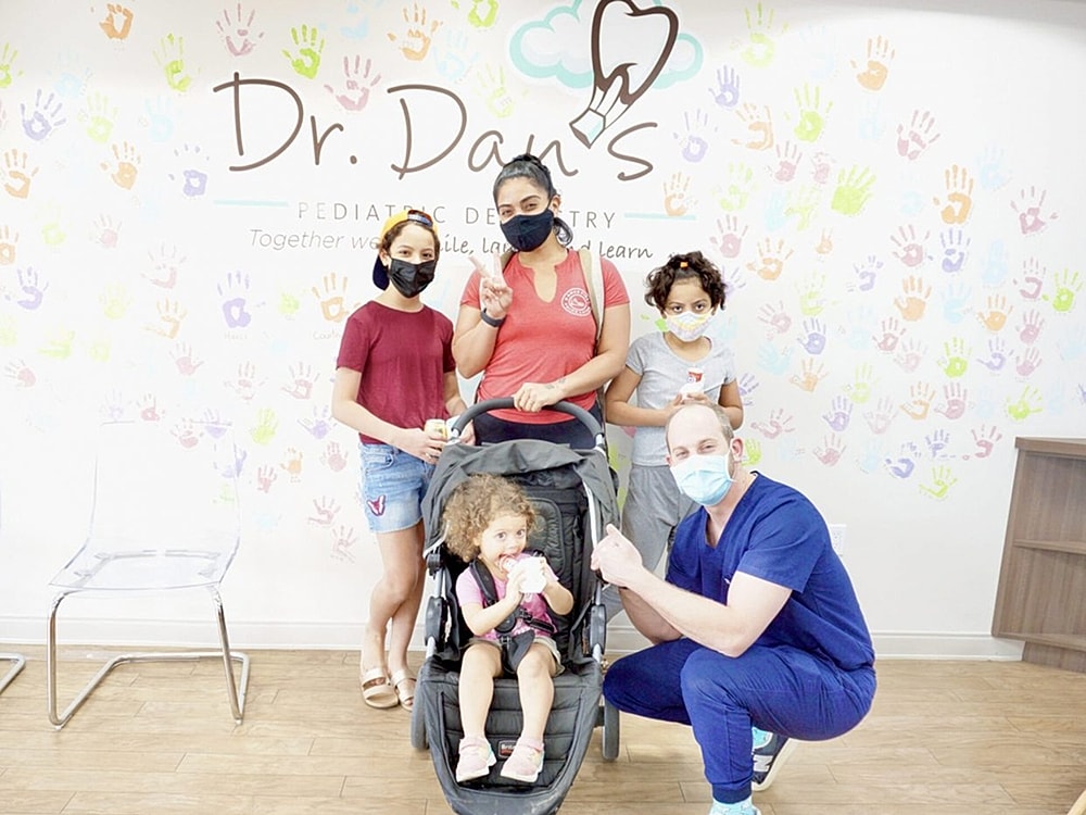 Family visiting pediatric dentist office together.